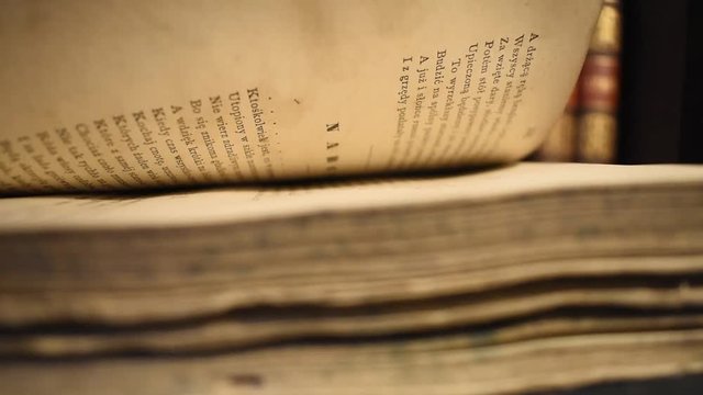 Reading an old book. Pages are flipped