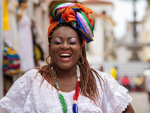 Happy Brazilian Woman of African Descent Dressed in Traditional Baiana Costumes in Salvador da Bahia, Brazil
