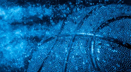 Gordijnen Closeup detail of basketball ball texture background. Blue filter © Augustas Cetkauskas
