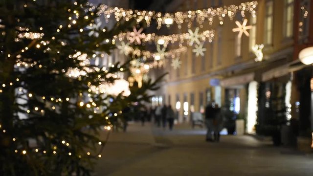Abstract blurred street view with beautiful Christmas decorations, at night, in the city center of Graz, Styria region, Austria.