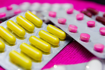 multicolored pills and antibiotics, the concept of drug treatment and pharmaceuticals. Treatment at the pharmacy.