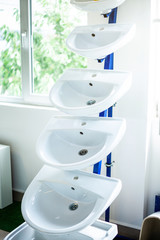 Different wash basins or sinks on display in shopping center showroom