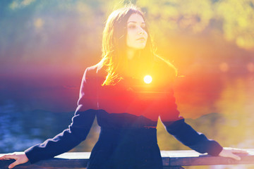 Double multiply exposure portrait of a dreamy cute woman standing outdoors, combined photograph of...