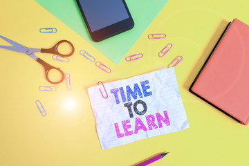 Text sign showing Time To Learn. Business photo text Obtain new knowledge or skill Educational or career growth Paper sheets pencil clips smartphone scissors notebook colored background