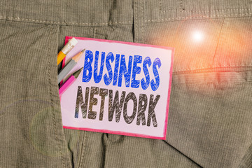 Text sign showing Business Network. Business photo text Interfirm cooperation that allows companies to collaborate Writing equipment and purple note paper inside pocket of man work trousers