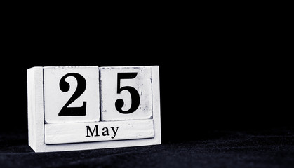 May 25th, Twenty-fifth of May, Day 25 of month May - vintage wooden white calendar blocks on black background with empty space for text