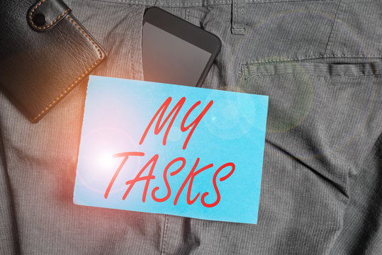 Conceptual hand writing showing My Tasks. Concept meaning assigned piece of work often to be finished within a certain time Smartphone device inside trousers front pocket with wallet