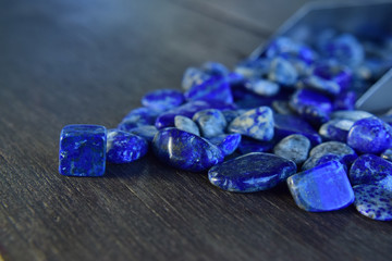  Lapis Is a beautiful natural gemstone on a wooden floor