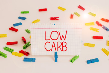 Writing note showing Low Carb. Business concept for Restrict carbohydrate consumption Weight loss analysisagement diet Colored clothespin papers empty reminder white floor background office