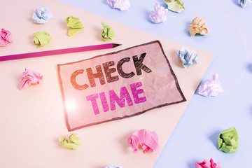Handwriting text writing Check Time. Conceptual photo instance of checking the time taken to cover a specific distance Colored crumpled papers empty reminder blue yellow background clothespin