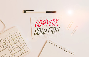 Text sign showing Complex Solution. Business photo showcasing significant ideas that are completely or partly repressed White pc keyboard with empty note paper and pencil above white background