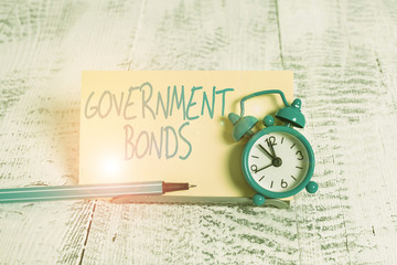 Handwriting text Government Bonds. Conceptual photo debt security issued by a government to support...