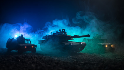 Military patrol car on sunset background. Army war concept. Silhouette of armored vehicle with soldiers ready to attack. Artwork decoration. Selective focus