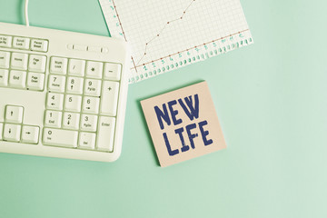 Conceptual hand writing showing New Life. Concept meaning Recovering from an unpleasant experience Start or change career Paper blue keyboard office study notebook chart numbers memo