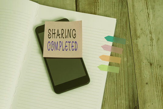 Word writing text Sharing Completed. Business photo showcasing to bring to an end and especially into a perfected state Note book four arrow banners smartphone sticky note old wooden background