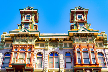 The Louis Bank of Commerce building, with A 1888 D inscribed on the facade, a colorful historic structure located at 835 5th Avenue in the Gaslamp Quarter, San Diego, California.