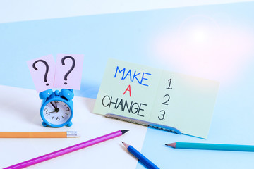 Text sign showing Make A Change. Business photo text Create a Difference Alteration Have an Effect Metamorphose Mini size alarm clock beside stationary placed tilted on pastel backdrop