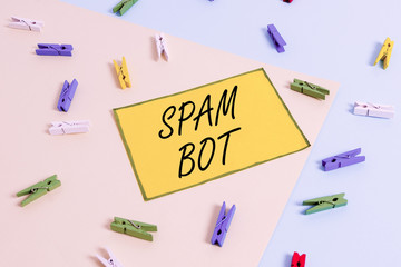 Word writing text Spam Bot. Business photo showcasing autonomous program on the Internet that sends spam to users Colored clothespin paper empty reminder yellow blue floor background office
