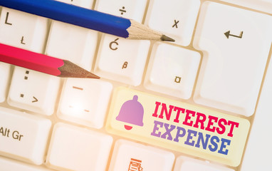 Word writing text Interest Expense. Business photo showcasing cost of debt that has occurred during...