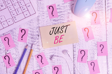 Word writing text Just Be. Business photo showcasing to do the things you believe in and want to be accepted for Writing tools, computer stuff and scribbled paper on top of wooden table