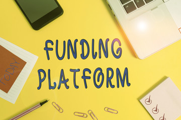 Text sign showing Funding Platform. Business photo text service that allows investments to be bought online Laptop smartphone notepad marker paper sheet note clips colored background