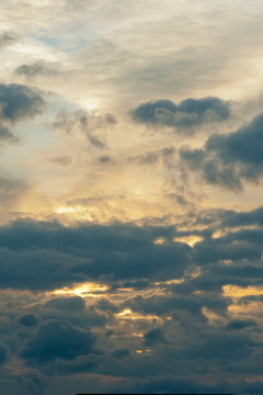 Gorgeous image of clouds and sunshine. Vertical shot.