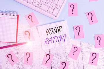 Handwriting text writing Your Rating. Conceptual photo score or measurement of how good or popular a demonstrating is Writing tools, computer stuff and math book sheet on top of wooden table