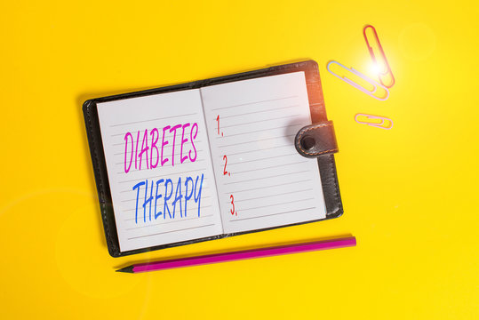 Conceptual hand writing showing Diabetes Therapy. Concept meaning aim to achieve lower average blood glucose results Dark leather locked diary striped sheets marker colored background