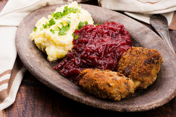 Prepared dinner on the plate. Melted meat, potatoes, beetroot