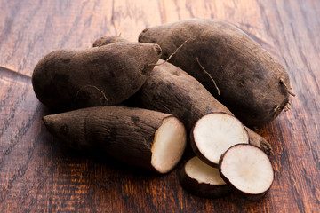 Fresh Yacon roots on wooden background