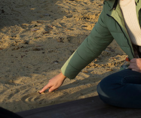 drawing on the sand hand heart