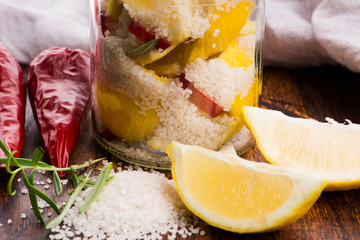 Preserved Lemons with salt on a wooden board