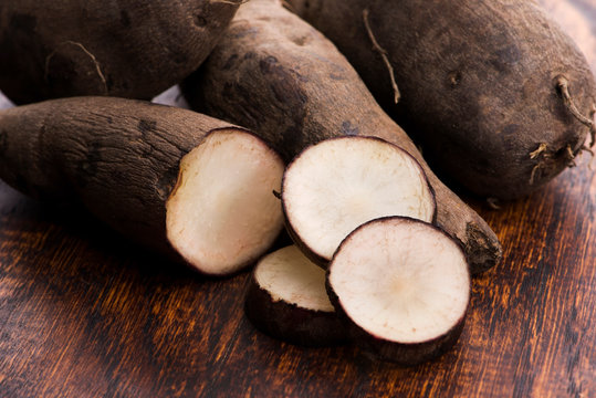 Fresh Yacon roots on wooden background