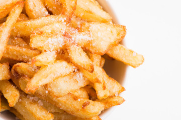 Bowl of potatoe fries on a white background
