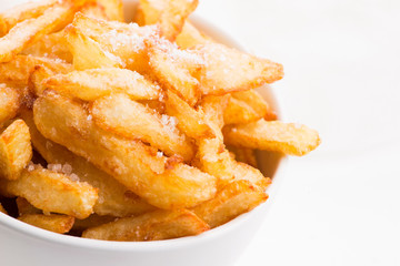 Bowl of potatoe fries on a white background