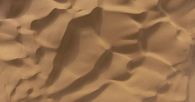 aerial view of sand and waves