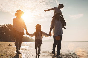 Holiday travel concept, Summer vacations. Happy family are having fun on a tropical beach in...