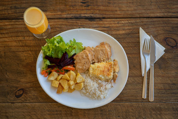 Delicious healthy food with chicken, rice and potato on dish. View from the top.