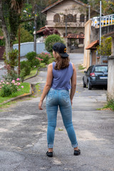 back view of standing young beautiful woman. Girl watching. Rear view people collection.  U Por Uj studio