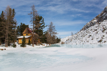 Altai mountain frozen lake with big stones