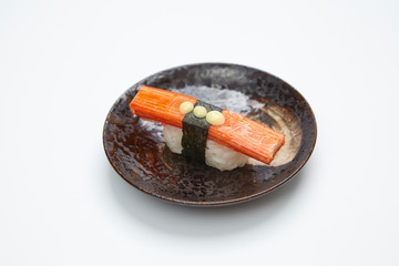 single served nigiri sushi made of kani kama isolated on white background
