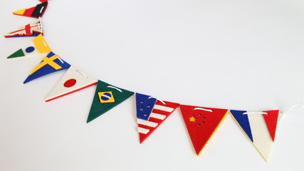 Obraz premium Handmade National Flags Garland on white