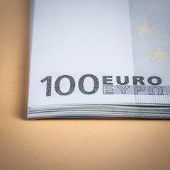 Euro cash on a yellow and pink background. Euro Money Banknotes. Euro Money. Euro bill. Place for text.