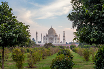 Fototapeta na wymiar Sunrise at the wonderful Taj Mahal, in Agra, one of the seven world wonder. Giant mausoleum made of marble.