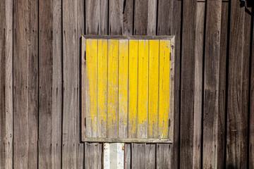 Old style window painted yellow.