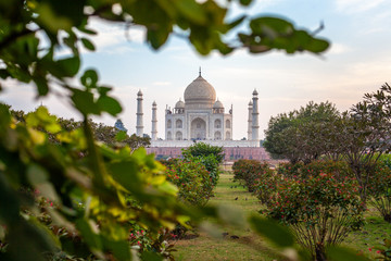 Fototapeta na wymiar Sunset at the wonderful Taj Mahal, in Agra, one of the seven world wonder. Giant mausoleum made of marble.