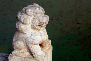 Ancient Chinese stone lion sculpture