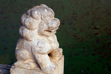 Fototapeta premium Ancient Chinese stone lion sculpture