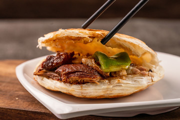 chinese hamburger in black plate