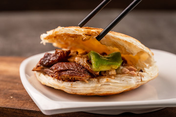 chinese hamburger in black plate